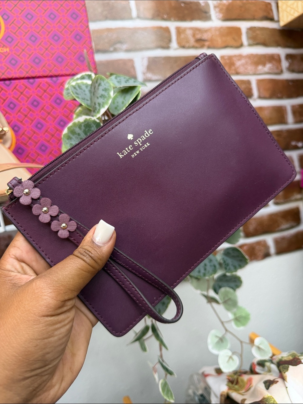 kate spade plum leather wristlet with floral strap